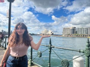 Abi Walling in front of the famous Sydney Opera House.